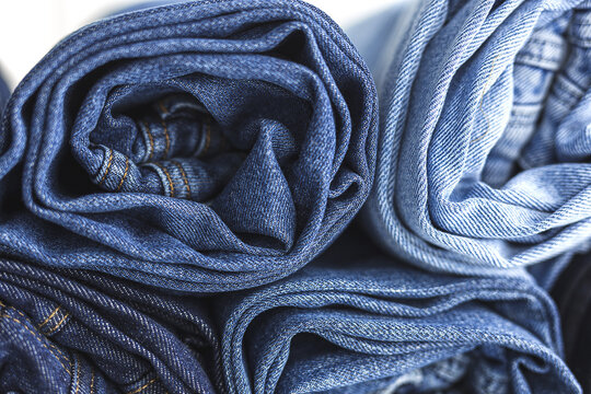 Heap of blue jeans in studio