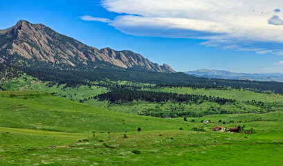 Fototapeta na wymiar Colorado's Flatirons are surrounded by open space protected from development thanks to a public land acquisition program adopted by the city of Boulder 50 years ago