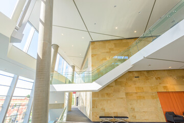 Obraz premium Abstract fragment of architecture of modern lobby, hallway of the luxury hotel, shopping mall, business center in Vancouver, Canada. Interior design.