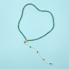 Women`s necklace of green malachite gem stones