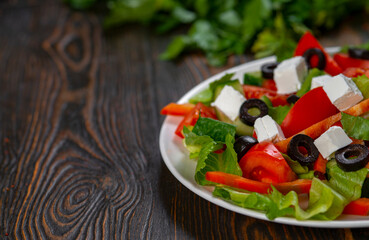 Traditional Greek salad with feta, olives and vegetables