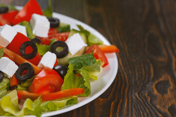 Traditional Greek salad with feta, olives and vegetables