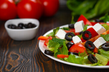 Traditional Greek salad with feta, olives and vegetables