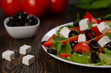 Traditional Greek salad with feta, olives and vegetables