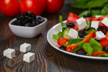 Traditional Greek salad with feta, olives and vegetables