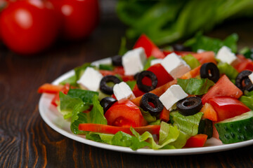 Traditional Greek salad with feta, olives and vegetables