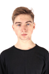 Obraz premium Portrait of a teenager, boy in puberty isolated on a white background