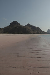 Fototapeta na wymiar One fine day with pink sand at Long Pink Beach, Labuan Bajo