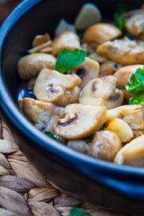 CHAMPINONES AL AJILLO, SPANISH GARLIC MUSHROOMS roasted in the oven with fresh herbs.