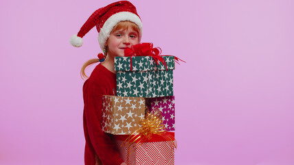 Girl in Christmas red sweater hat looking surprised at mount of boxes hands, excited by so many holiday gifts, lot of presents. Happy New Year presents shopping sale celebration merry holiday concept
