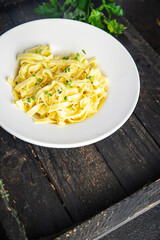 pasta cream sauce fettuccine or tagliatelle macaroni meal snack on the table copy space food background rustic. top view