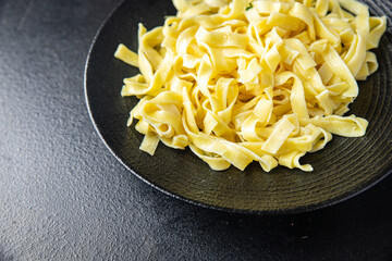 pasta cream sauce fettuccine or tagliatelle macaroni meal snack on the table copy space food background rustic. top view