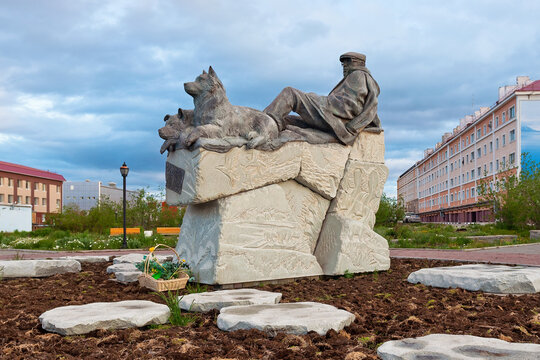 Anadyr, Chukotka, Russia - July 7, 2011. Monument to the Chukchi writer Yuri Rytkheu (1930-2008). Sculpture of a man with dogs on the stones. Tourist attractions of the city of Anadyr and Chukotka.
