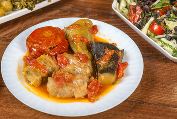 Dolma with cabbage, eggplant, tomatoes and pepper. Cabbage rolls with meat, rice and vegetables.Traditional Caucasian, Ottoman, Turkish cuisine.