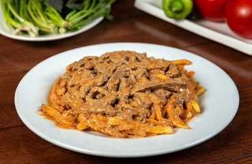 Beef Stroganoff traditional Russian dish of beef in sauce, served with fried potatoes.