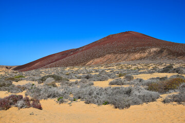 Montana Bermeja at the beach Playa de las Conchas. The island La Graciosa, belonging to Lanzarote, Canary Islands, Spain.