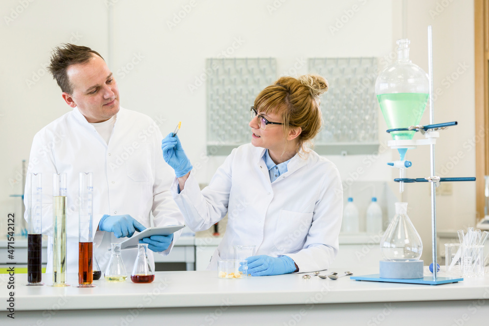 Wall mural two scientists working with terpene crystals in laboratory