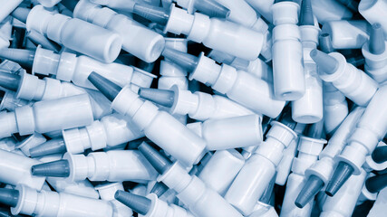 Close-up Many white plastic spray bottles for packaging liquid medicines or cosmetics
