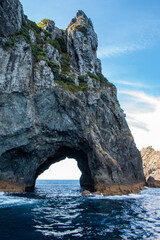 Fototapeta na wymiar The Hole in the Rock at Piercy Island, Cape Brett, Bay of Islands