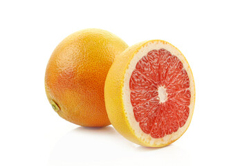 Whole and sliced grapefruit isolated on white background