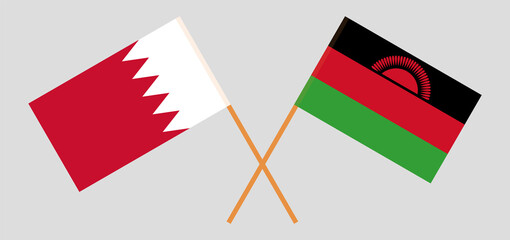 Crossed flags of Bahrain and Malawi. Official colors. Correct proportion