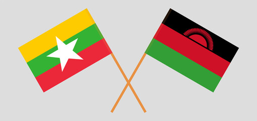 Crossed flags of Myanmar and Malawi. Official colors. Correct proportion
