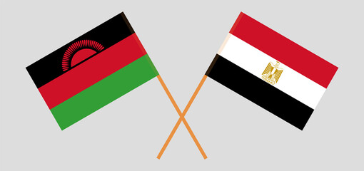 Crossed flags of Malawi and Egypt. Official colors. Correct proportion