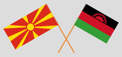 Crossed flags of North Macedonia and Malawi. Official colors. Correct proportion