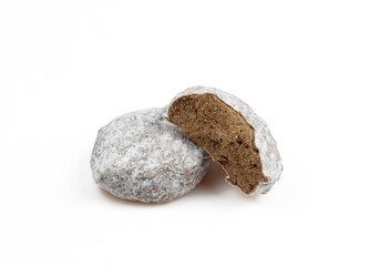 Two belgian truffles covered with powder isolated on white background