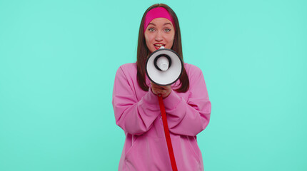 Hurry up. Cheerful teenager student girl in pink hoodie scream shout in megaphone loudspeaker...