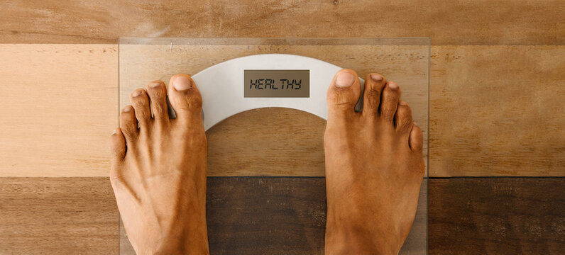 pair of feet on a weight scale, healthy concept.