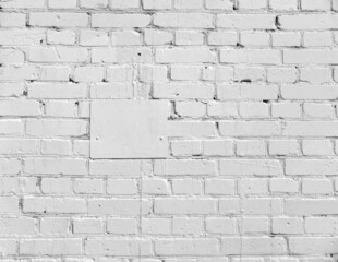 Old Brick wall painted with white paint and white plate.