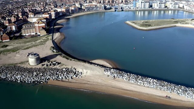 Aerial footage of the beach protecting the entrance to Sovereign Harbour at Eastbourne and the Martello Tower number 66.