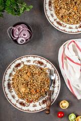 buckwheat porridge with meat and spices on the table