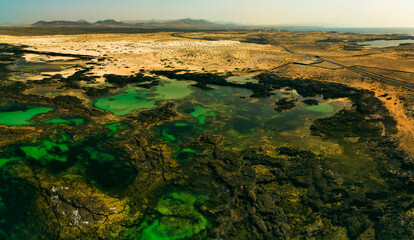 Fototapeta na wymiar Natural volcanic rock pools El Cotillo Fuerteventura Spain