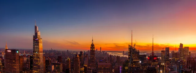 Wall murals Empire State Building Panoramic view of Manhattan at sunset.  Among the buildings seen are the Empire State Building, the One World Trade Center and the new One Vanderbilt building.  
