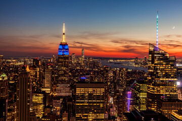 View of Manhattan looking out over the Empire State Building, One World Trade Center and the Statue of Liberty