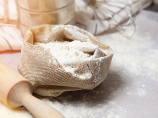 Ingredients for baking: flour, eggs, sugar, close-up on a gray marble background