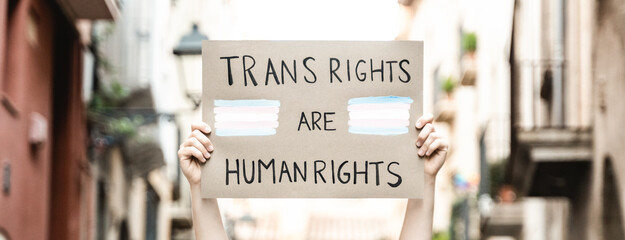Trans people at gay pride protest holding transgender flag banner - Lgbt celebration event concept - obrazy, fototapety, plakaty