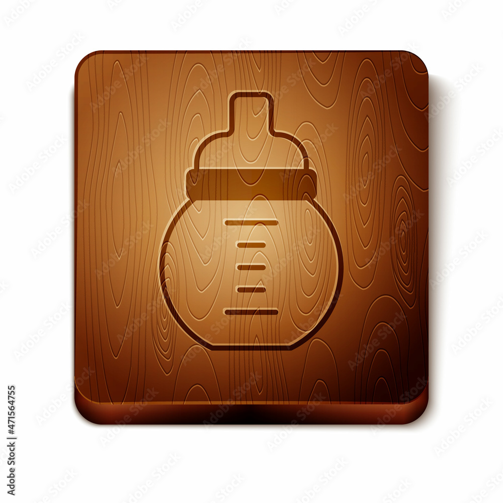 Sticker brown baby milk in a bottle icon isolated on white background. feeding bottle icon. wooden square bu