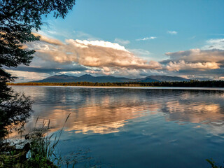 Lake reflecting clouds at dusk