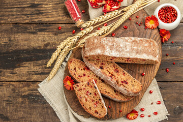 Whole grain bread with cranberry for holidays. Fresh homemade bakery, dry spikelets