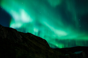 Naklejka premium Northern lights outside Tromsø, Norway. Photo: Marius Fiskum