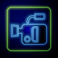 Glowing neon Cinema camera icon isolated on blue background. Video camera. Movie sign. Film projector. Vector