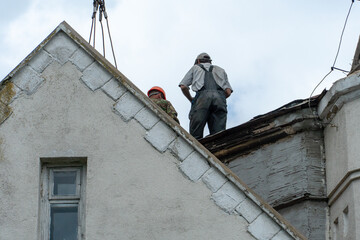 Repair of the roof of a beautiful old building in the city center. High-altitude work involves a...