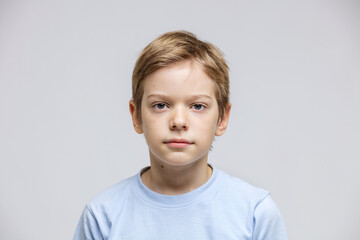 Portrait of cute young boy looking at camera