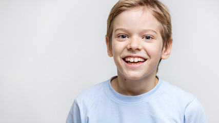 Closeup portrait of joyful young boy
