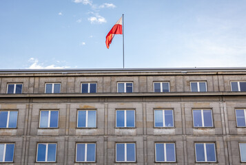 Fototapeta na wymiar Flag on Ministry of Economic Development and Technology headquarters in Warsaw city, Poland