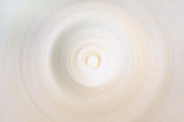 Glowing light beige and yellow circular blur