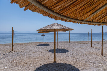 Empty beach in Benitses town on the Ionian Sea shore on Corfu Island, Greece